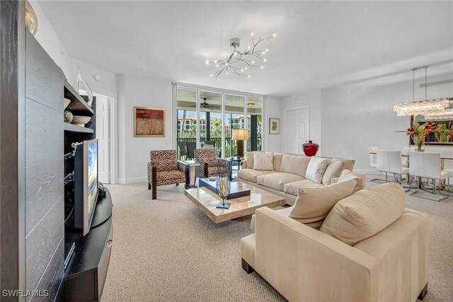 living area with an inviting chandelier, carpet, and baseboards