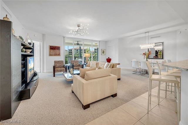 23540 Via Veneto Blvd Unit 202, Estero, FL 34134 - living area with light carpet, light tile patterned floors, visible vents, and a chandelier