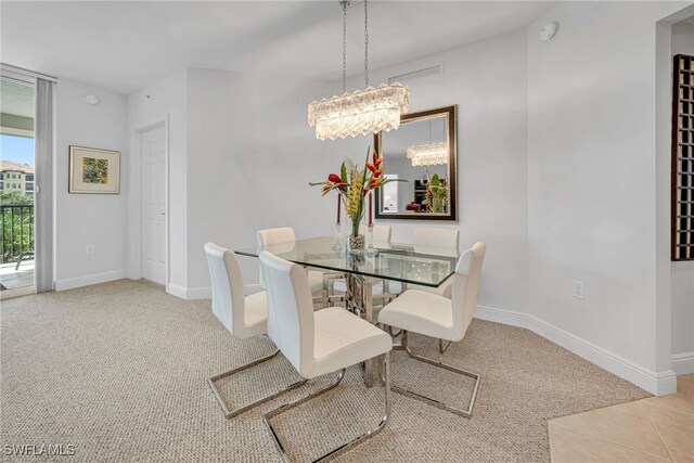 dining room with baseboards and carpet