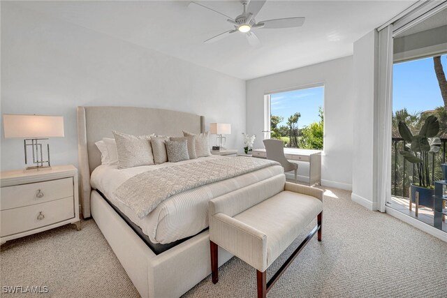 bedroom featuring light colored carpet, ceiling fan, baseboards, and access to outside