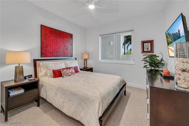 bedroom with carpet flooring, baseboards, and ceiling fan