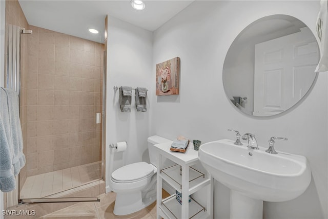 23540 Via Veneto Blvd Unit 202, Estero, FL 34134 - bathroom featuring toilet, a stall shower, a sink, recessed lighting, and tile patterned flooring