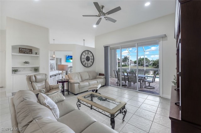 tiled living room featuring built in features and ceiling fan