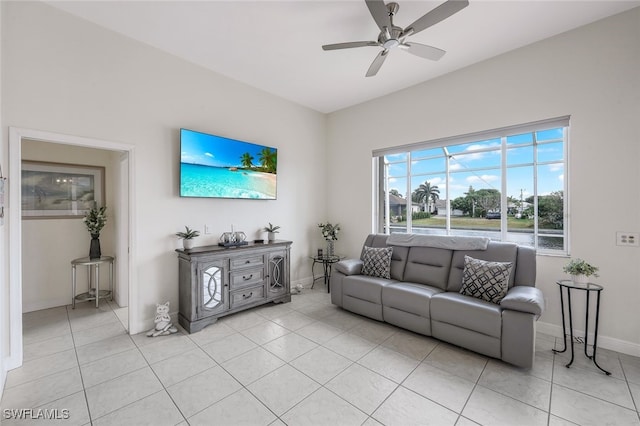 tiled living room featuring ceiling fan