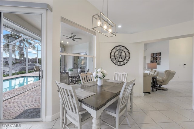 dining space with ceiling fan and light tile patterned floors