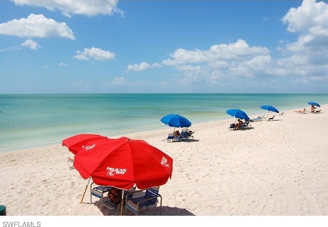 property view of water featuring a beach view