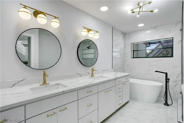 bathroom featuring vanity and a washtub