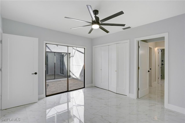 unfurnished bedroom featuring ceiling fan and a closet