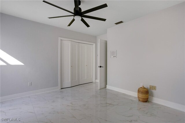 unfurnished bedroom featuring a closet and ceiling fan