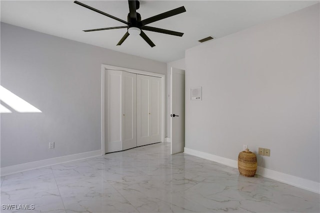 unfurnished bedroom with a closet and ceiling fan