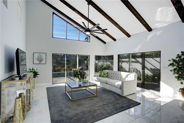 living room featuring ceiling fan, high vaulted ceiling, and beamed ceiling