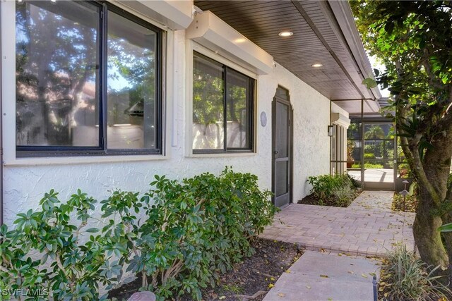 doorway to property featuring a patio area