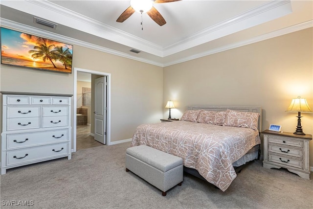 bedroom with a raised ceiling, ceiling fan, ornamental molding, and light colored carpet