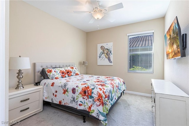 bedroom featuring ceiling fan and light colored carpet