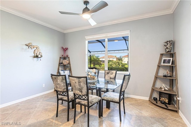 dining area with ceiling fan and crown molding