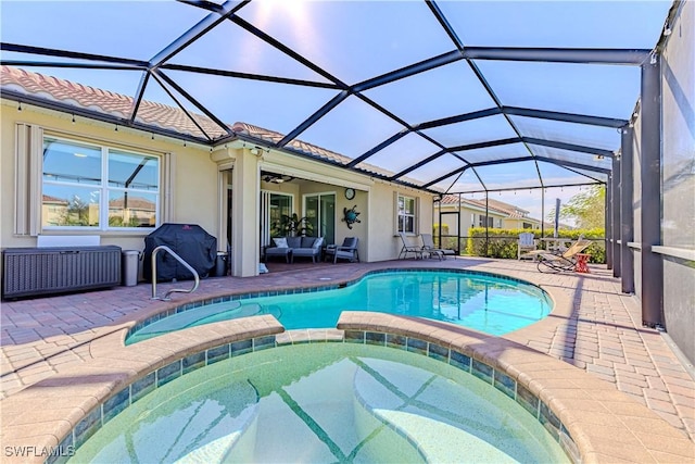 view of pool with a lanai, a patio area, outdoor lounge area, area for grilling, and ceiling fan