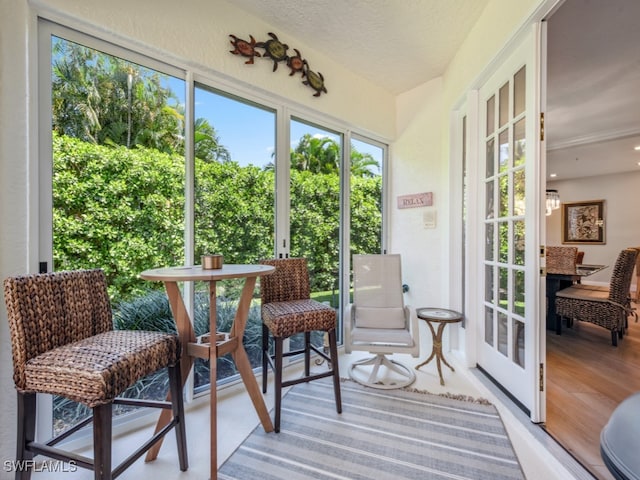 sunroom with a chandelier