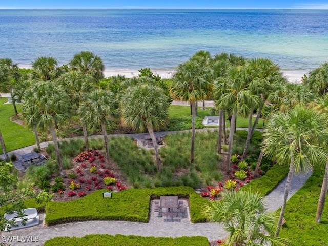 birds eye view of property featuring a view of the beach and a water view