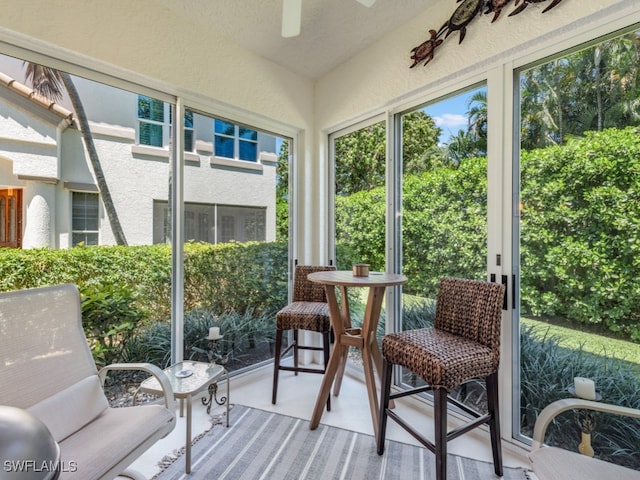 sunroom / solarium with ceiling fan