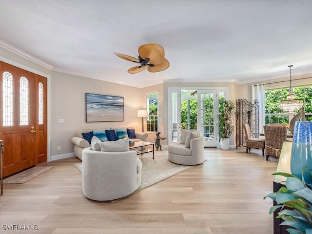 241 Colonade Cir, Naples, FL 34103 - living area featuring healthy amount of natural light, light wood-type flooring, crown molding, and baseboards
