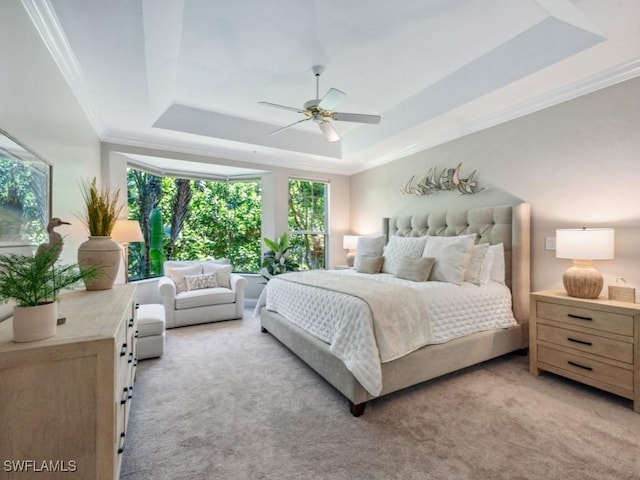 241 Colonade Cir, Naples, FL 34103 - bedroom with a raised ceiling, ornamental molding, light colored carpet, and a ceiling fan