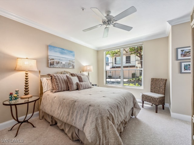 bedroom with ceiling fan, crown molding, and light carpet