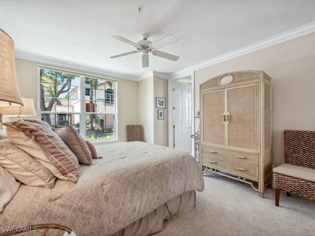 bedroom with carpet, ceiling fan, and crown molding