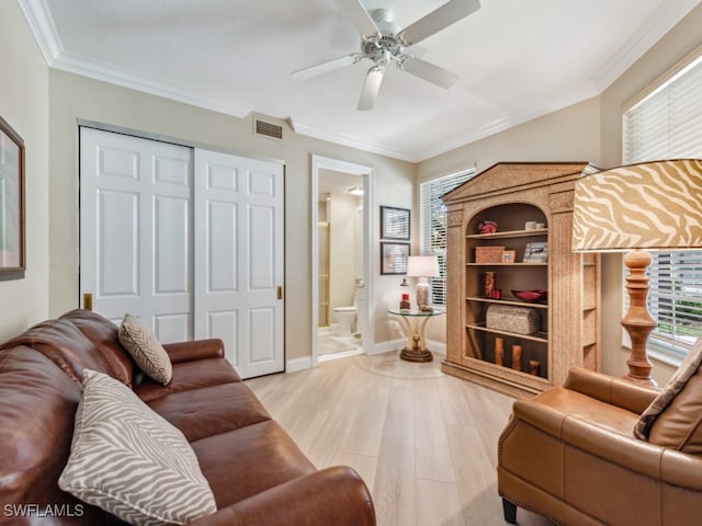 living room featuring ceiling fan, light hardwood / wood-style floors, and ornamental molding