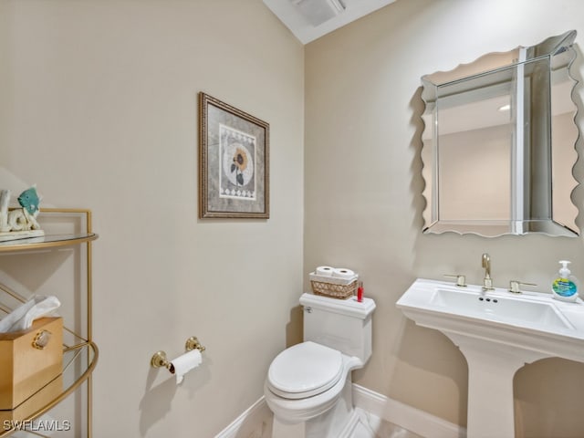 bathroom with sink and toilet