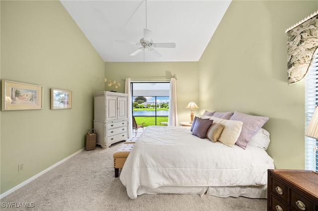 carpeted bedroom with vaulted ceiling and ceiling fan