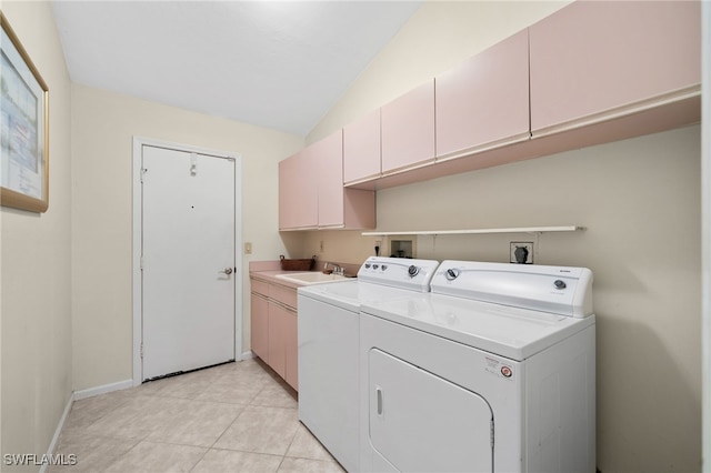 laundry area featuring sink, cabinets, light tile patterned floors, and washer and dryer