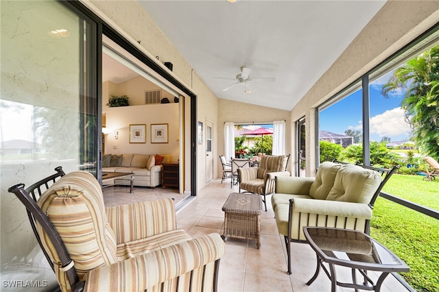 sunroom / solarium with ceiling fan and lofted ceiling