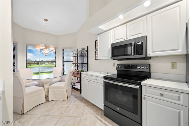 kitchen featuring range with electric stovetop, a notable chandelier, light tile patterned floors, and white cabinets