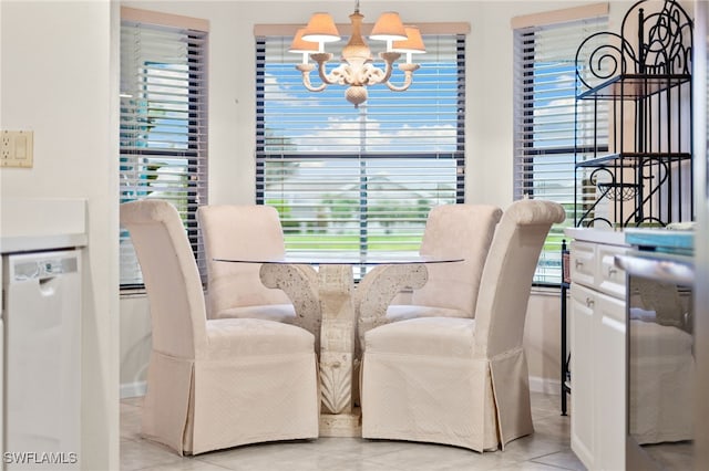 tiled dining area featuring a notable chandelier