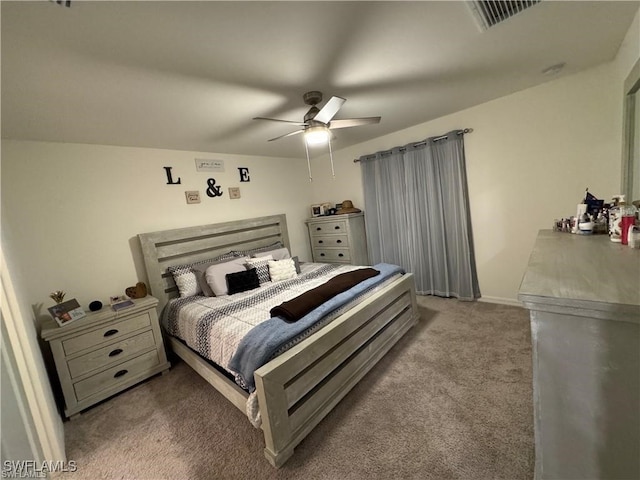 bedroom with ceiling fan and light colored carpet