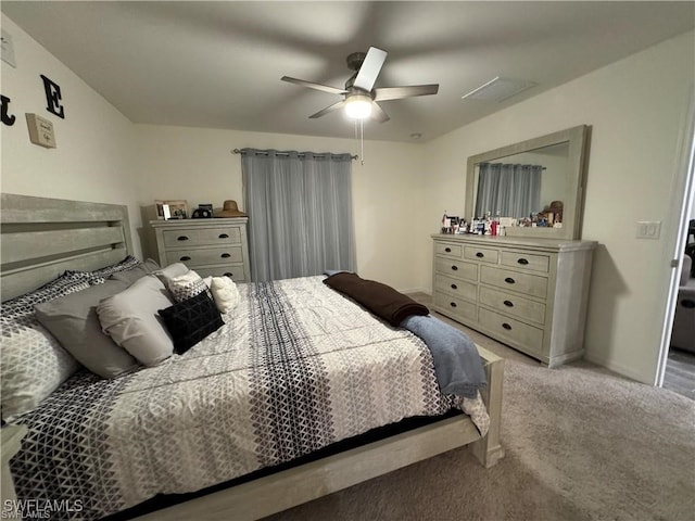 bedroom with ceiling fan and light colored carpet