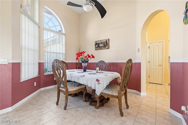 tiled dining area featuring ceiling fan