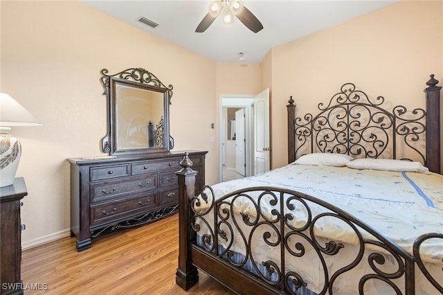 bedroom with ceiling fan and light wood-type flooring