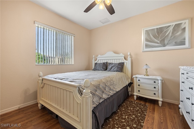 bedroom featuring dark hardwood / wood-style flooring and ceiling fan