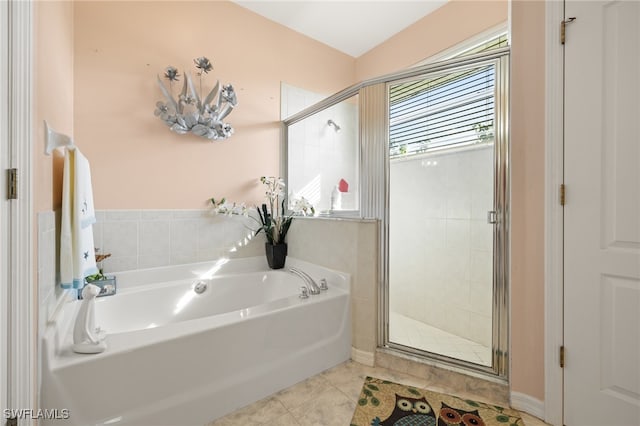 bathroom featuring plus walk in shower and tile patterned floors