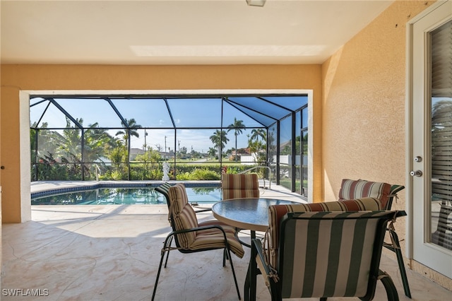 view of patio / terrace with a lanai