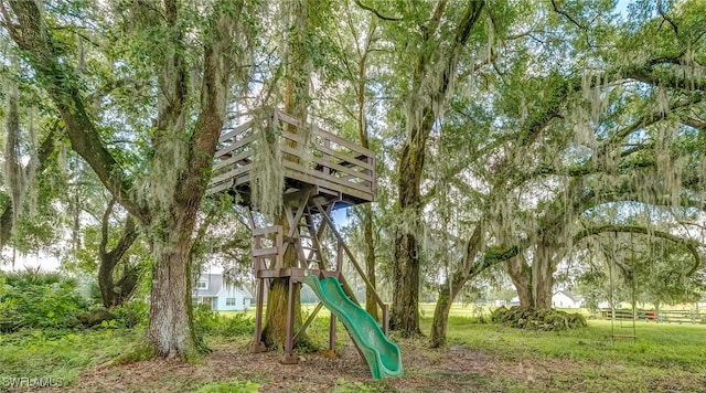 view of jungle gym featuring a yard