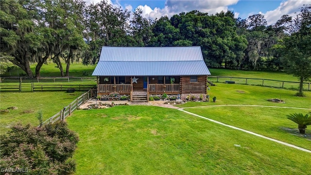 view of front of house featuring a rural view and a front yard