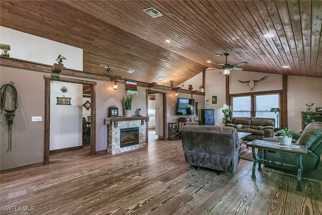 living room with high vaulted ceiling, wood ceiling, a stone fireplace, and hardwood / wood-style flooring