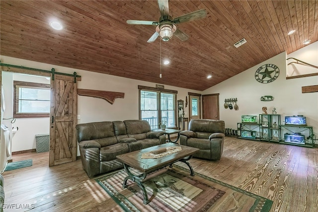 living room featuring wood-type flooring, ceiling fan, a barn door, high vaulted ceiling, and wood ceiling