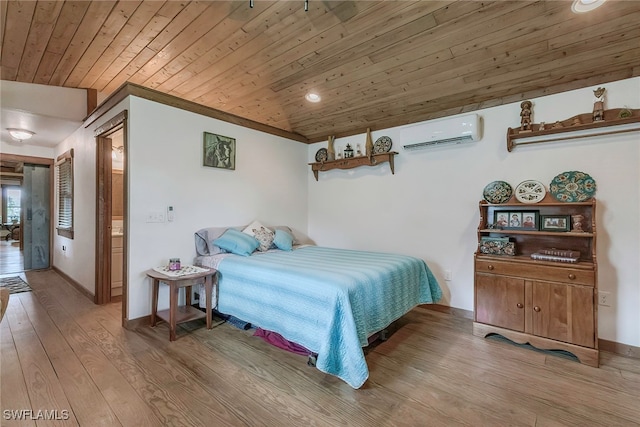 bedroom featuring a wall mounted AC, light hardwood / wood-style floors, and wood ceiling