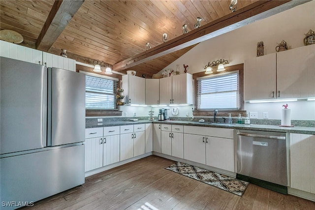 kitchen featuring appliances with stainless steel finishes, sink, and white cabinetry