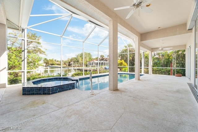 view of pool featuring an in ground hot tub, a lanai, ceiling fan, a water view, and a patio