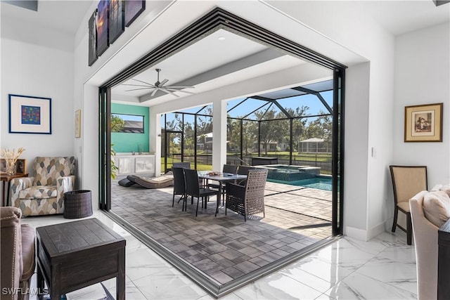 854 SW 15th Ave, Cape Coral, FL 33991 - interior space with marble finish floor, baseboards, a sunroom, and ceiling fan