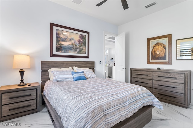 bedroom with ceiling fan and connected bathroom